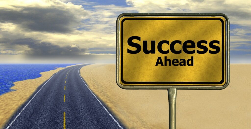 A road sign that says "Success Ahead"