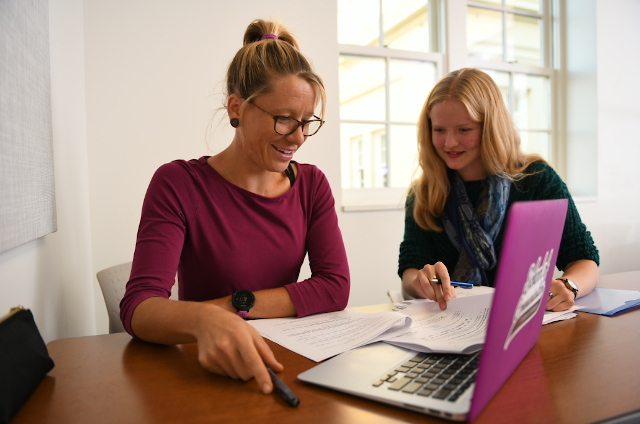 A student assisting an instructor