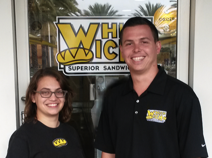 Chiara stands with the owner of Which Wich