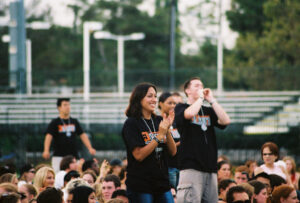 People cheering on a field