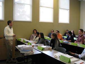Dr. Brice Corgnet discusses the study of Virtual Organizations with Graduate workshop participants