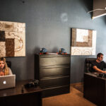 two people at desks working