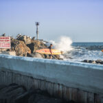 surfer at jetty