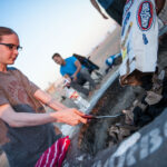 student lighting bonfire