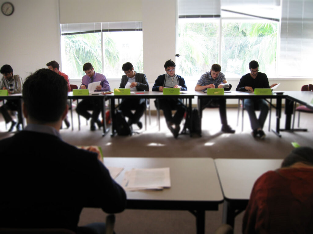 student in business class reviewing paperwork