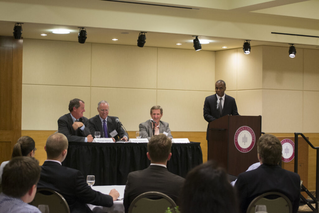 Dean Gilyard speaking to business student