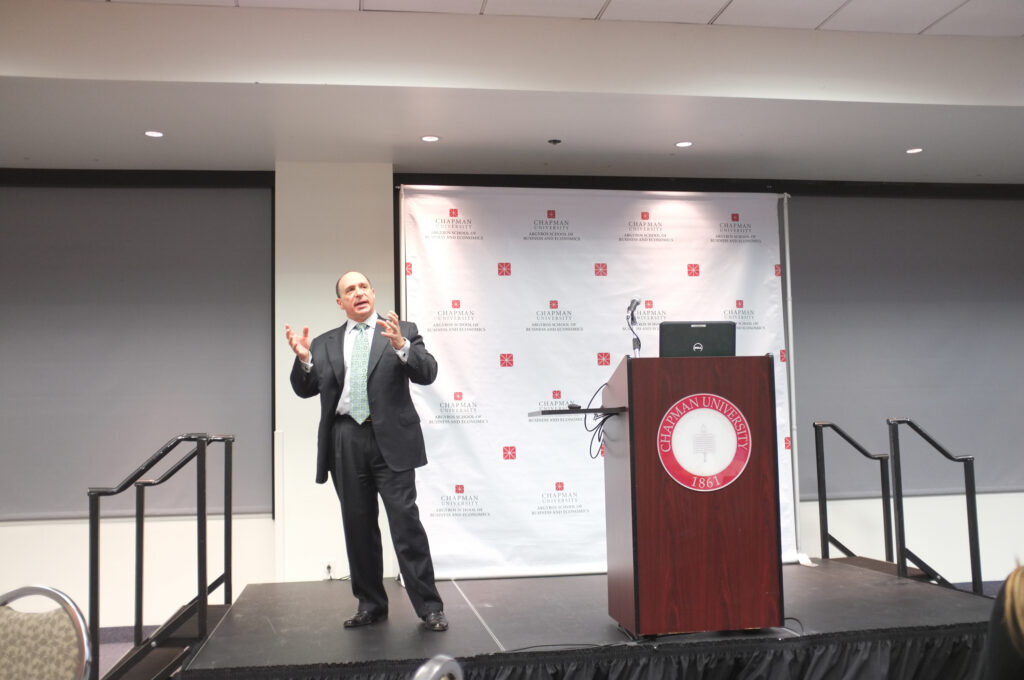 Businessman Eric Brandt speaks to the Argyros School community.