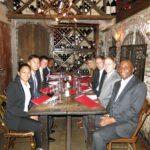 Argyros Students dining with Dean
