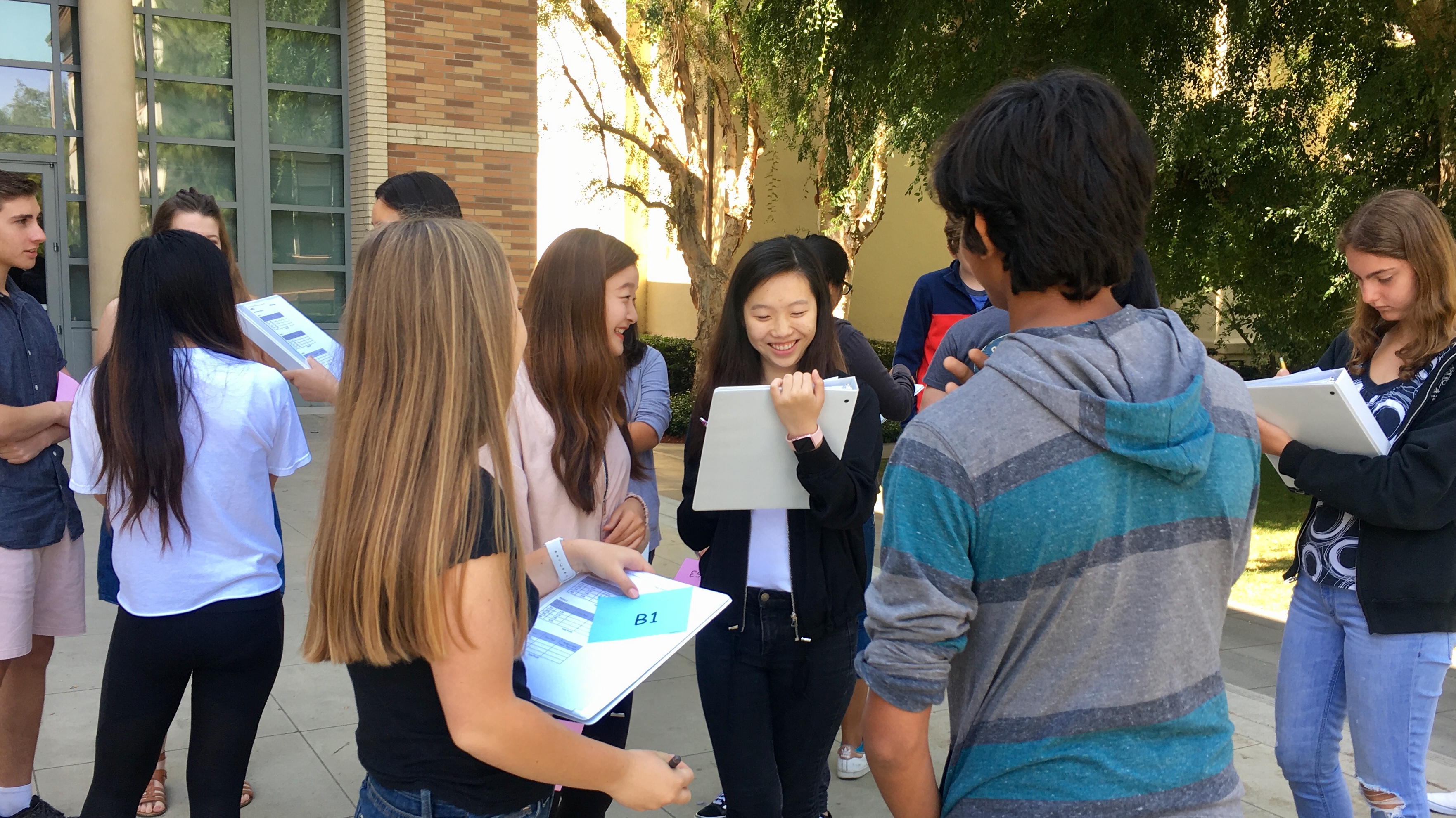 Students outside interacting with each other