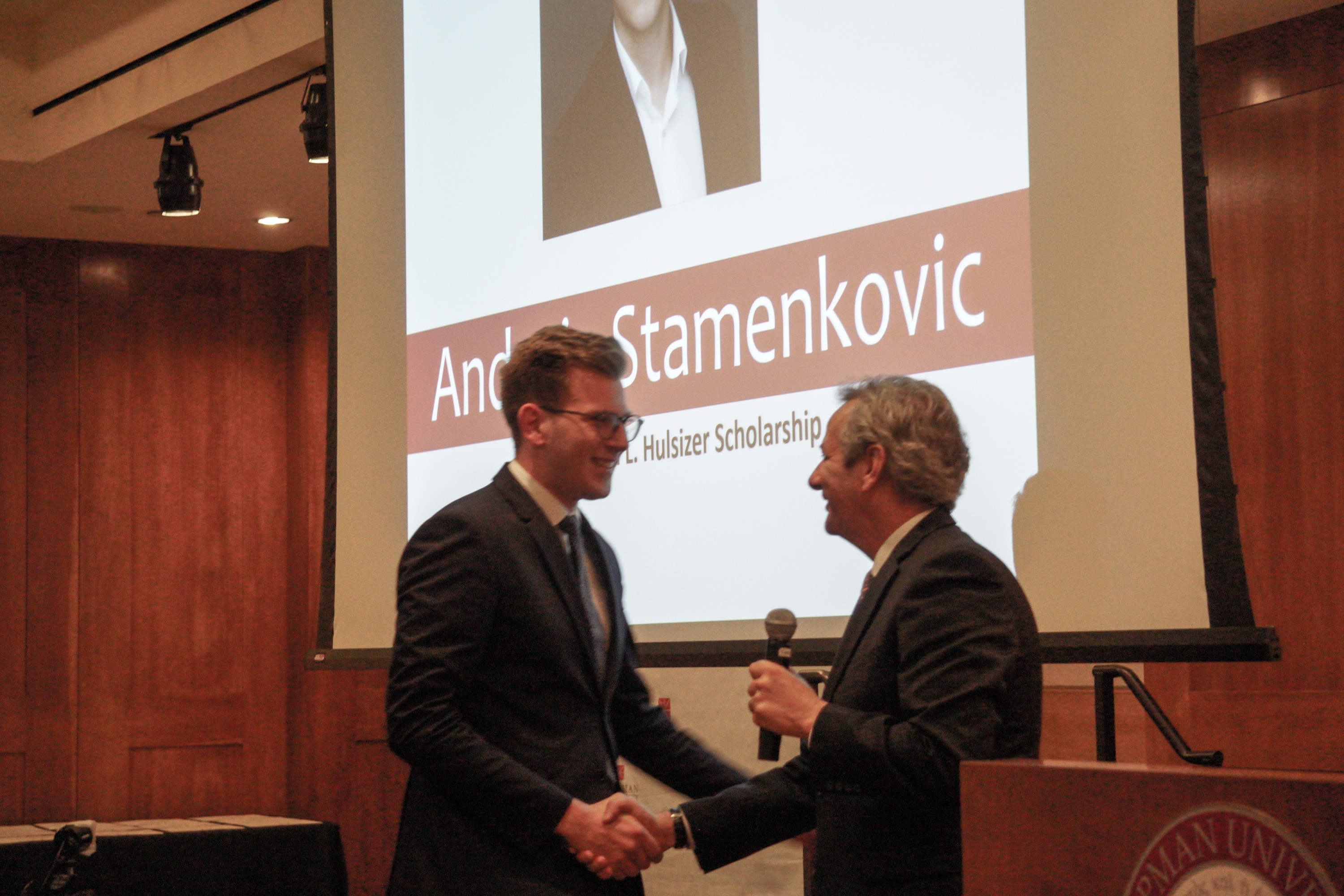Andreja Stamenkovic and Dean Turk shaking hands