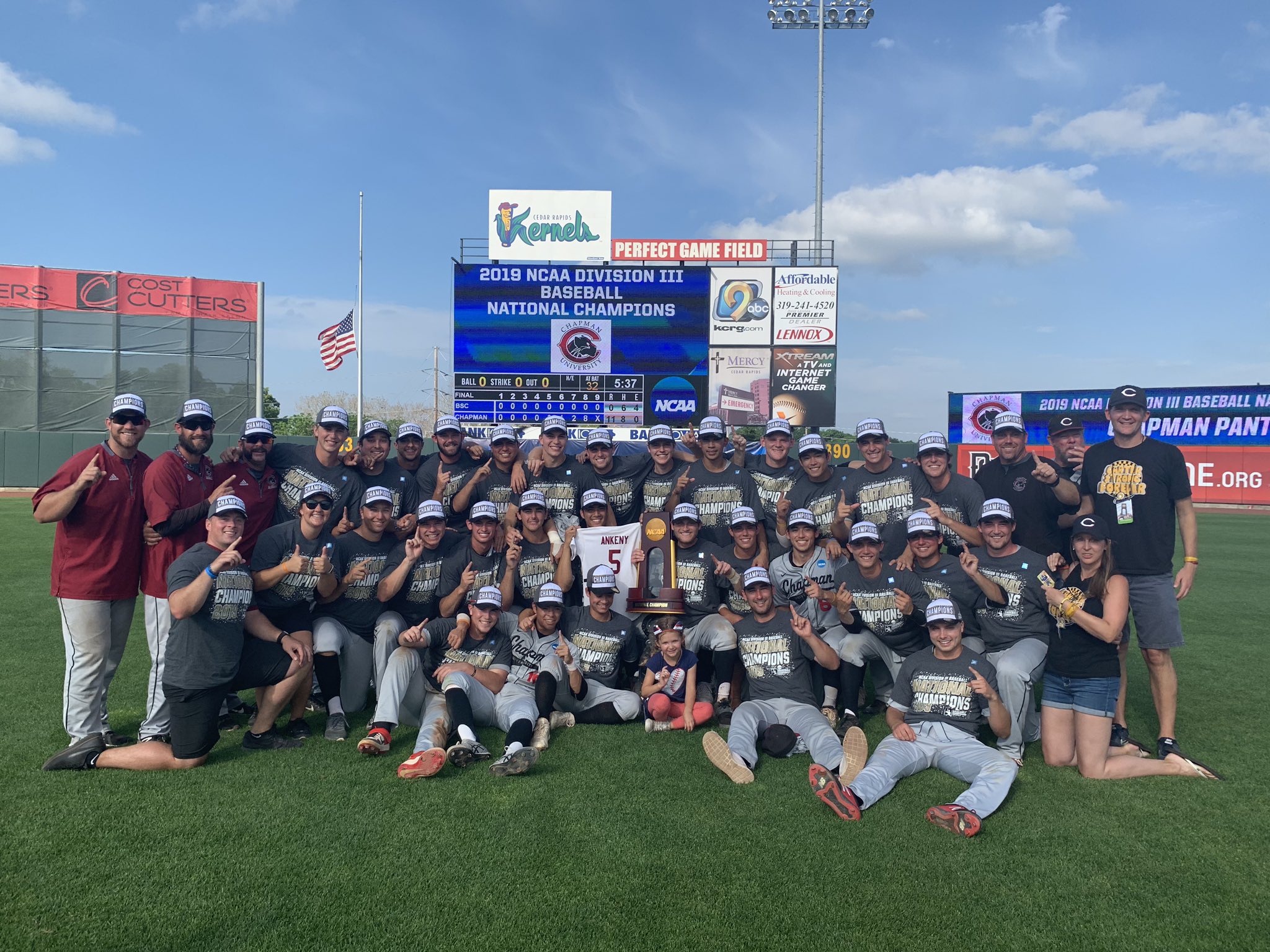 Full team on field celebrating national championship