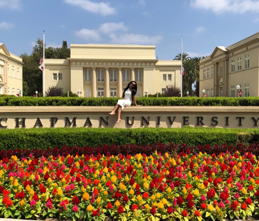 Brianna Gonzalez on "Chapman University" sign