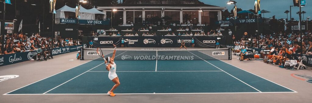 Woman serving in Tennis