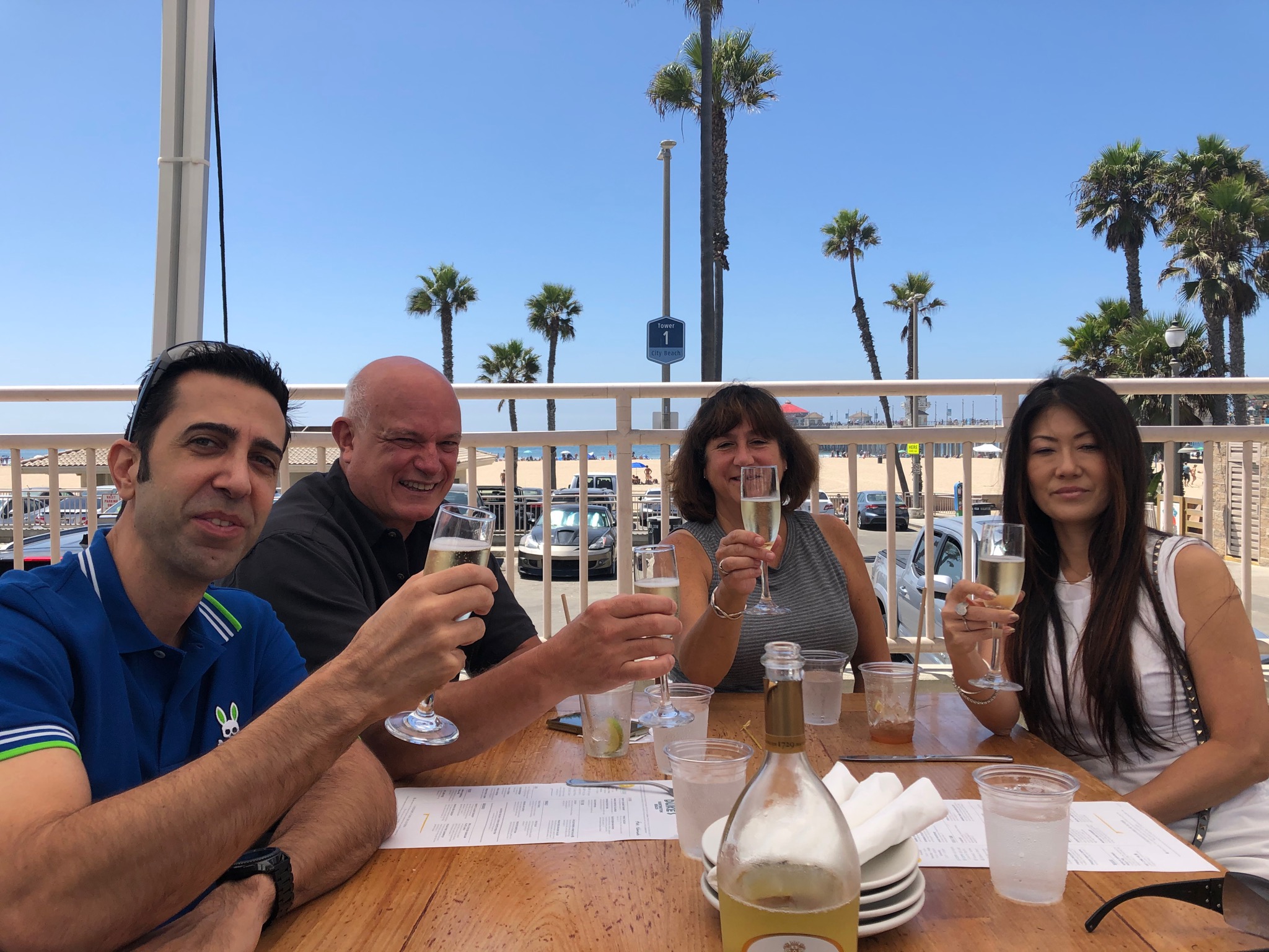 Darcy Mayer, Mario and Carol Leone and Tammy Mayer toasting a drink