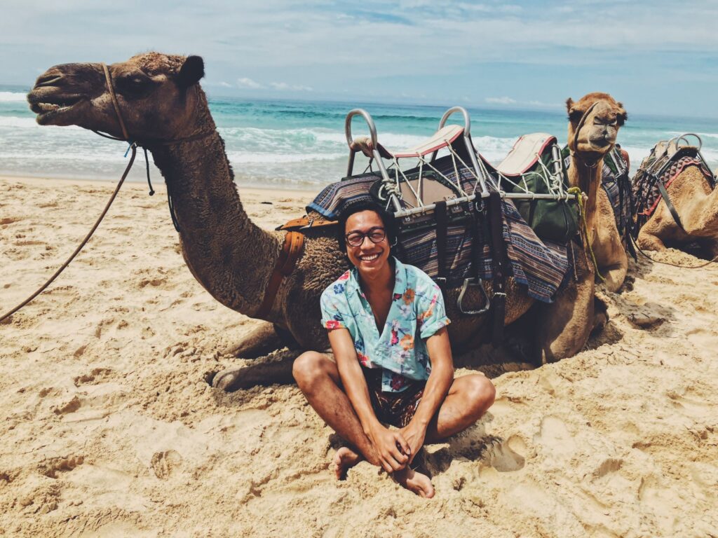 Student with camel in Australia