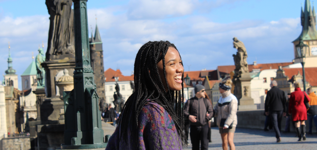 Maia walking across a bridge in Prague