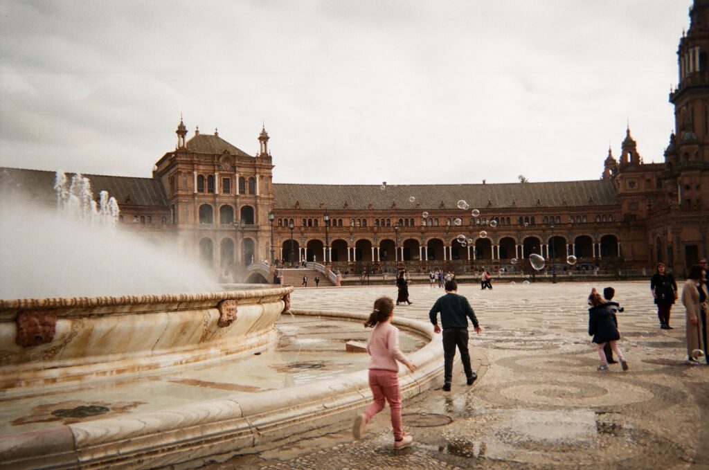 Kids run around at Plaza de Espana