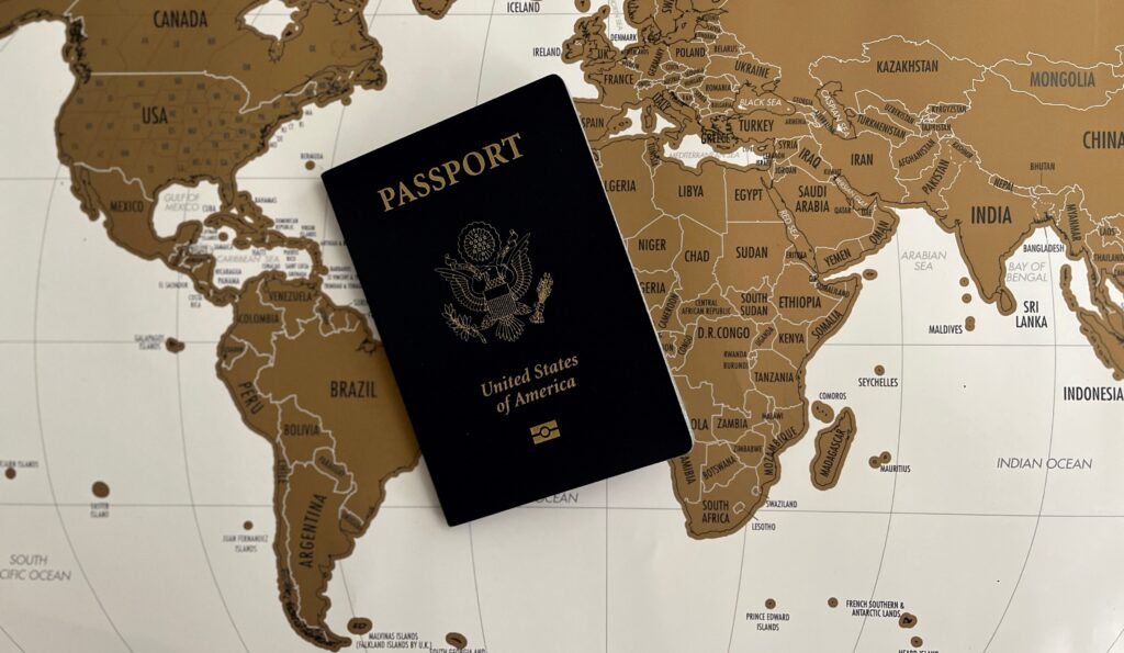 Passport on beige world map