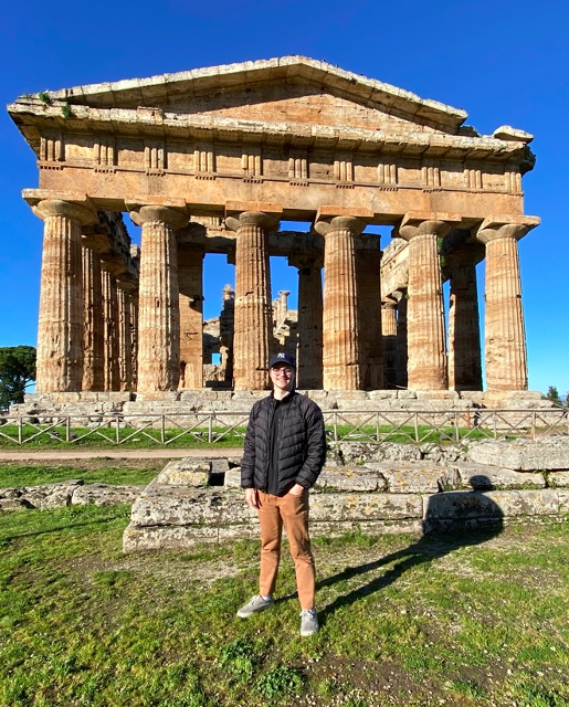 Student in front of temple