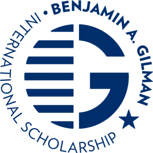 gilman logo in blue with g in middle and full name circling it