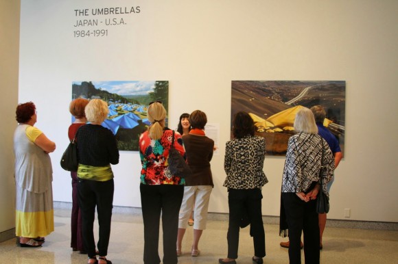 people looking at artwork