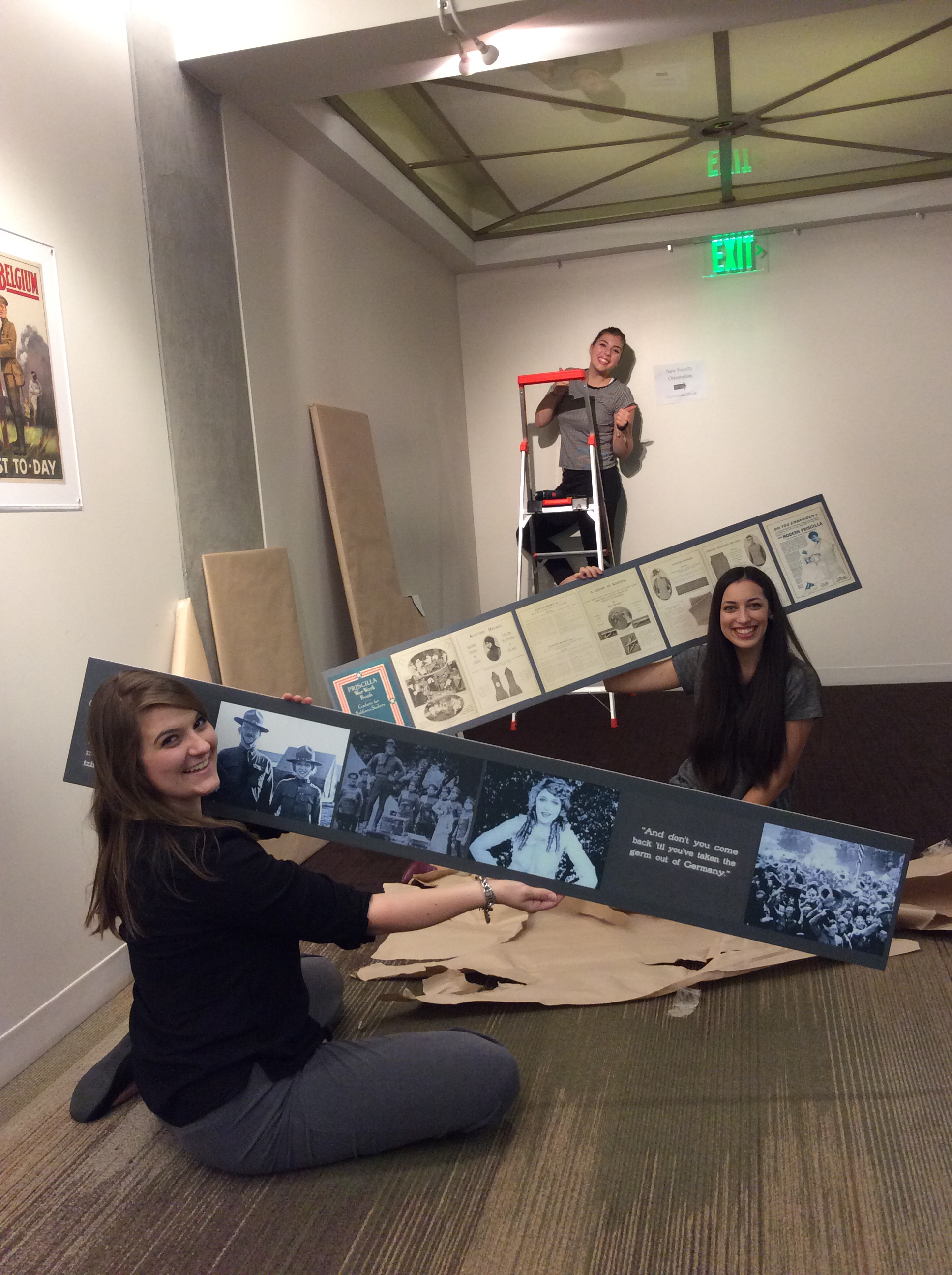 students holding art