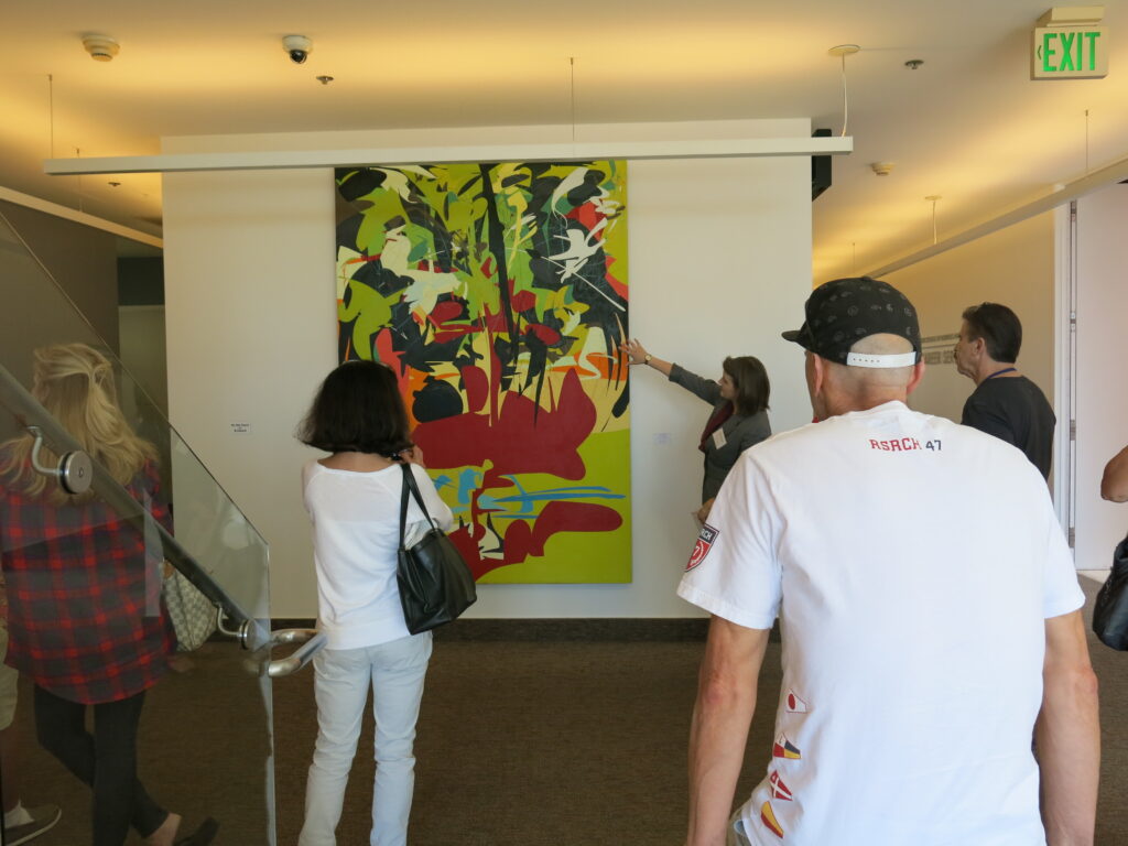 people looking at artwork