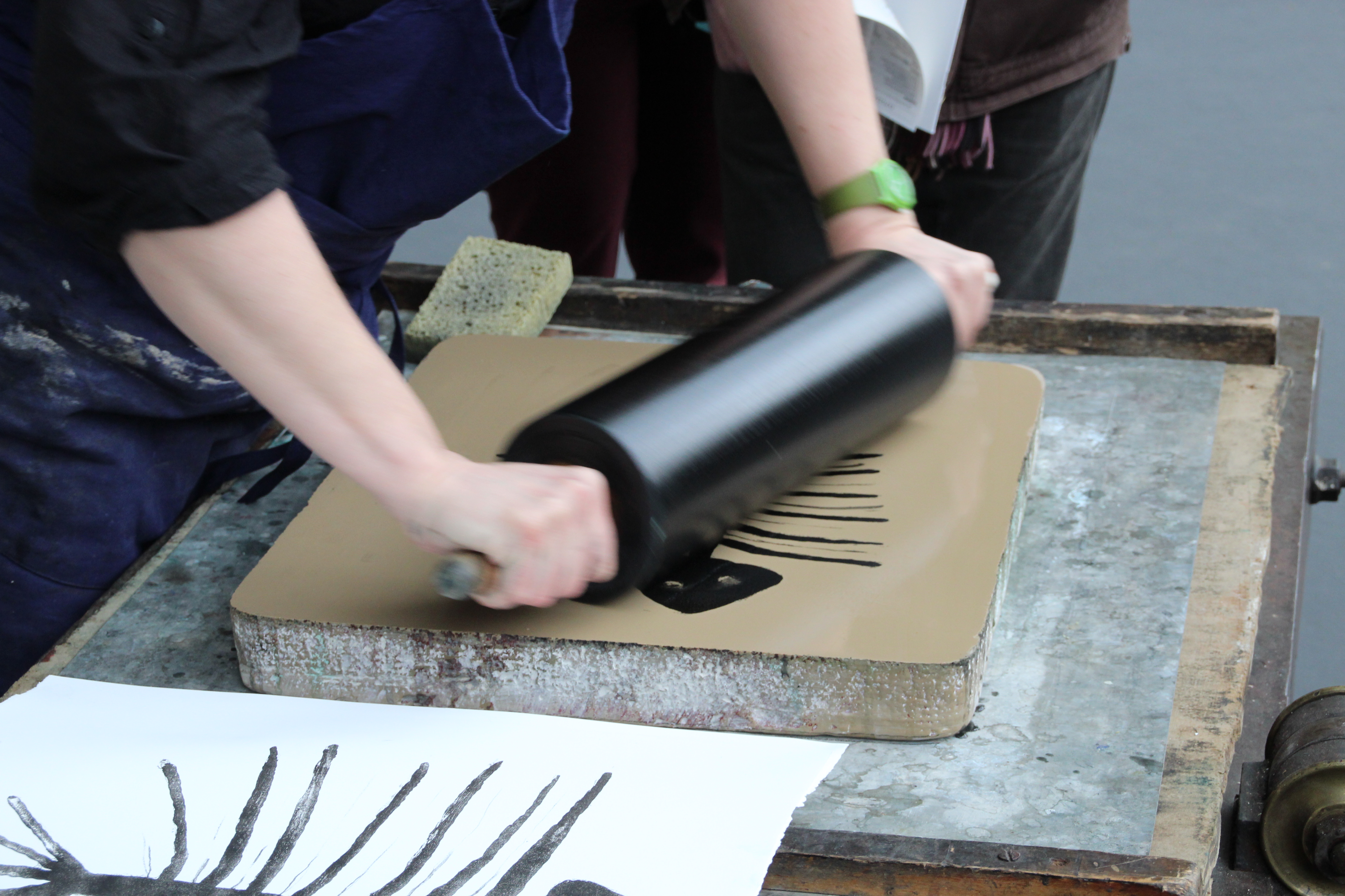 An artist creating a lithograph
