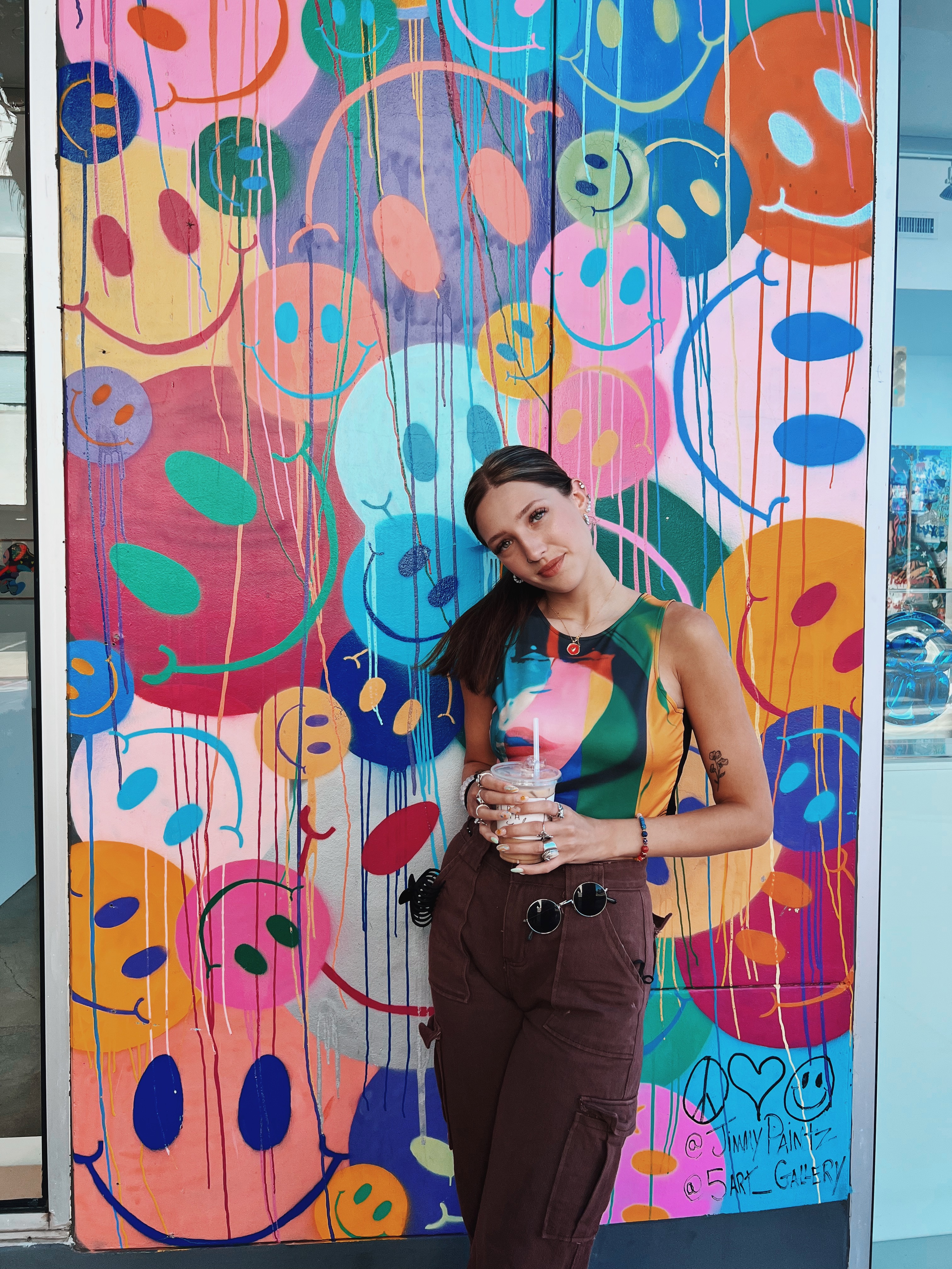Picture of Brianna in front of a colorful wall