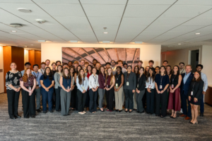 large group photo of external and internal staff and interns 