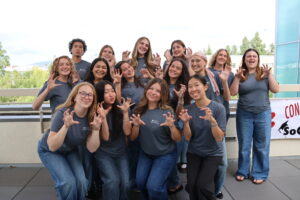 student advisory board group photo with their school of communication shirts 