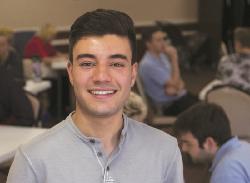 Jacob Pace, a student who coordinates tech help for seniors in Orange