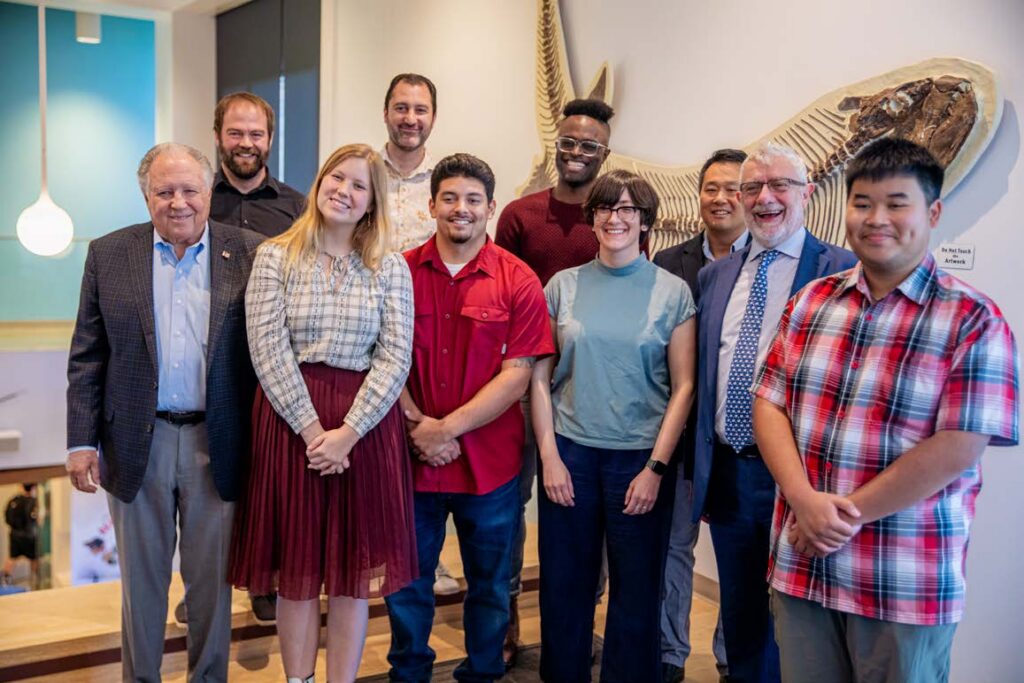 Gary Wescombe with President Daniele Struppa, faculty, alumni and students at the announcement of the Wescombe STEM Scholarship at Schmid College Oct. 3.