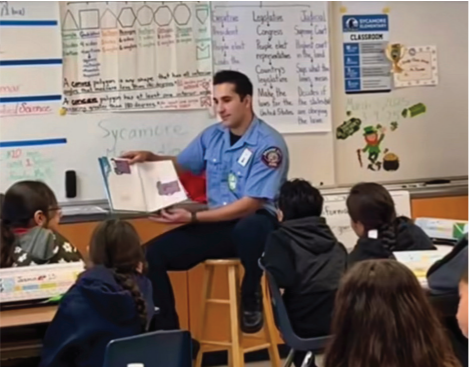 Chapman University graduate Mo Hijazi teaches fire safety to elementary school students in the Orange Unified School District