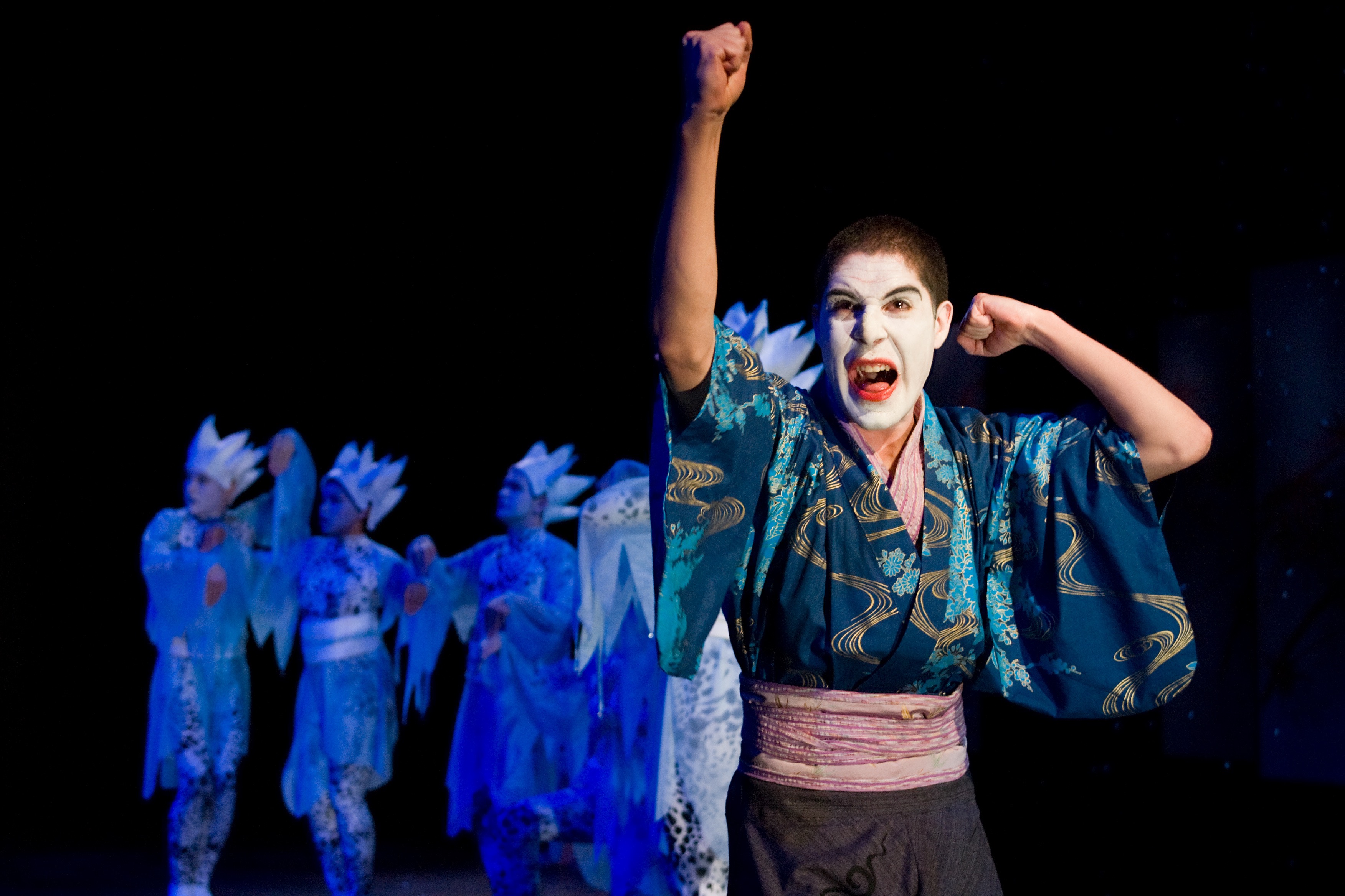 Actors performing in costume.