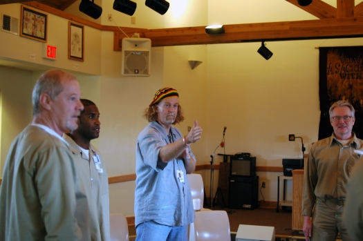 Director Curt L. Tofteland works with inmates at a rehearsal for the Shakespeare Behind Bars program.