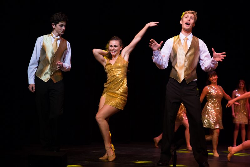 Dancers and singers on stage