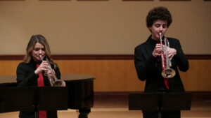 Tim Healy performing with another student trumpet player at Music at Noon