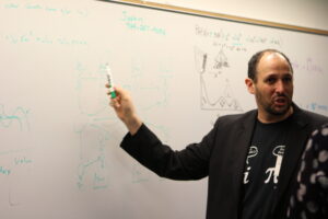 Man with a marker at Chapman Big Data event
