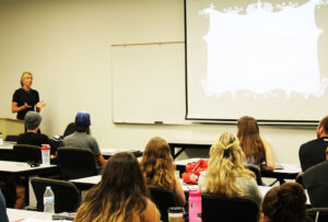 Dotsie Bausch speaks to a class of students