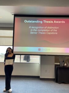 Student holding an award