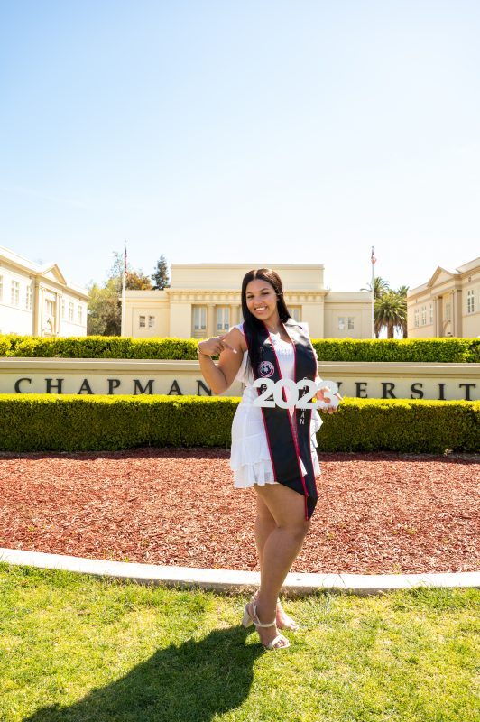Shaylee Posing in front of Chapman Sign