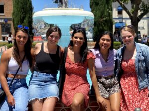 Sarah Rightmire sitting with friends