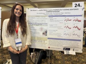 Danielle in front of a research poster