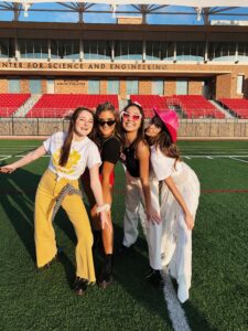 Lily with Friends on football field