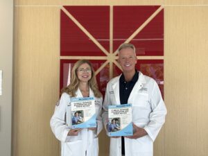 Anne Walsh and Mike Burney with Textbook