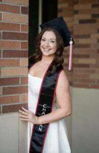 Abby watson in graduation regalia