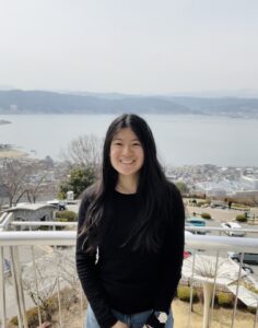 Emi traveling by the sea
