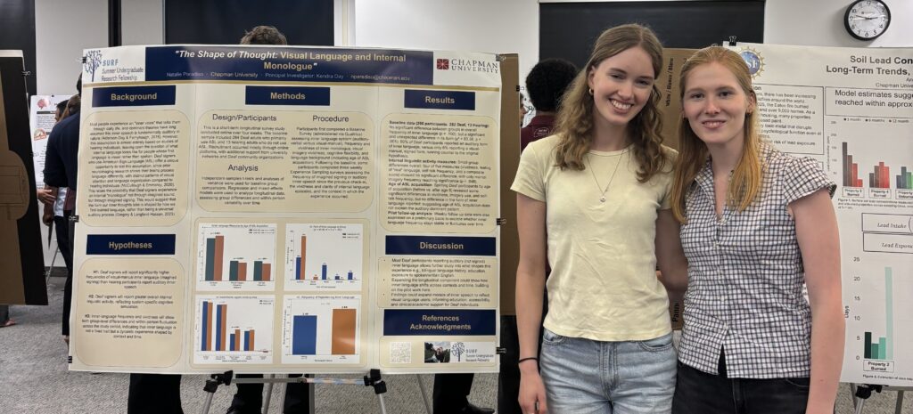 Natalie presenting research with friend