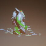 The robot-student, stepping around his virtual world. The marks below him are the steps recorded by the mocap suit.